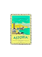 Load image into Gallery viewer, A rectangular enamel postcard magnet with a depiction of Astoria, Oregon on it.